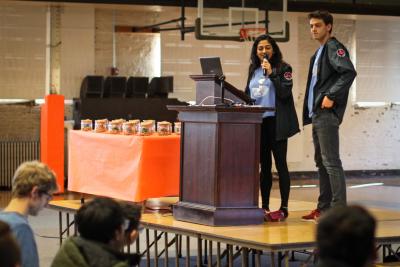 HackIllinois 2019 Co-Directors Aparajitha Adiraju and Spencer Gilbert talk to the crowd in Kenny Gym, one of the venues for this year's event.