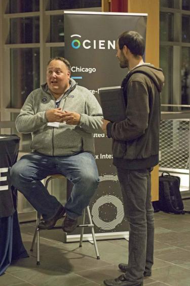 Ocient CTO and co-founder Joe Jablonski, left, talks to a student during the Oct. 25 ThinkChicago Roadshow.