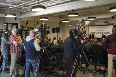 Chicago news media cover the Feb. 23 announcement by Mayor Rahm Emanuel and ServiceNow CEO John Donahoe, both seated at right, of the company's West Loop plans.