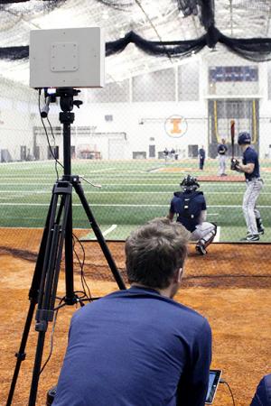Charlie Young uses a FlightScope during a Fighting Illini Baseball practice.