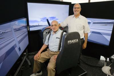 Rudy Frasca (seated) founded Frasca International in 1958. Today his son, John (standing), serves at the companyâ€™s CEO.