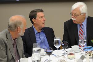 Richard M. Schell (middle) speaks with Professor Roy H. Campbel (left) and Emeritus Professor Dennis Mickunas (right).