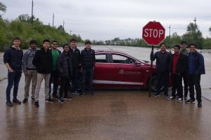 Autonomous Vehicles in AI (CS 598) was taken by 35 students. One group programmed a car to detect the distance to a stop sign from a video inside the vehicle then stop it in the right place.
