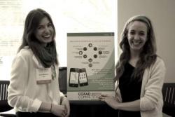 Babu developers Dana Chambourova (left) and Amanda Sopkin share their idea at a poster presentation.