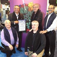 Recipients of the HPCwire Editor&rsquo;s Choice Award. Kneeling (from left): Bill Kramer, director of Blue Waters; and John Stone, senior programmer with Beckman Institute. Standing: Tom Tabor, CEO of Tabor Communications, publisher of HPCwire; Klaus Schulten; and Sanjay Kale.