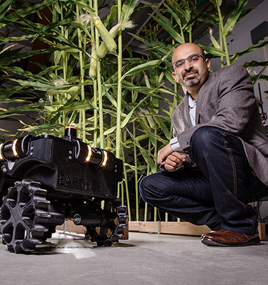 Girish Chowdhary, pictured here with the TerraSentia robot, won an Illinois Innovation Network award in August 2021.