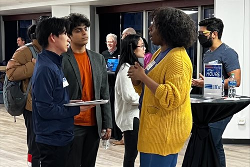 Photo from the After Hours event in Chicago featuring a number of students speaking with company recruiters in an informal setting.