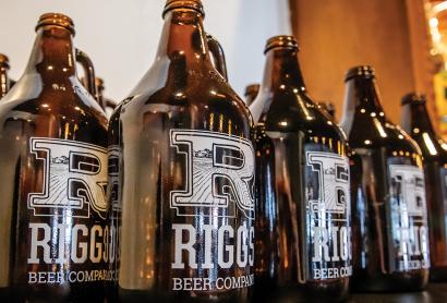 Customers who visit the Riggs taproom in Urbana can buy glass growlers of beer to take home. (photo by L. Brian Stauffer)