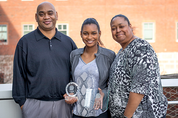 Aja Capel, center, with her father, Parrish Capel, and her mother, Dr. Shawn Love.